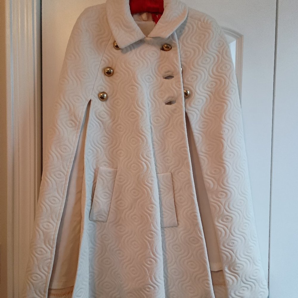 WHITE "EMBOSSED" SWING CAPE WITH FRONT POCKET